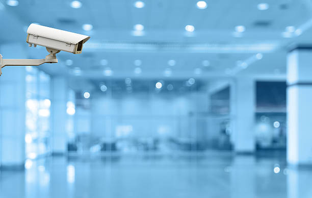 istock Security camera monitoring the store and escalator blur with bok 474089392