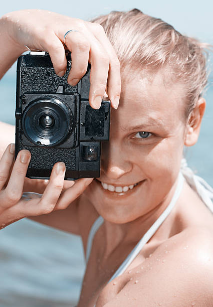 istock Woman laughing as she views a photo 474092669