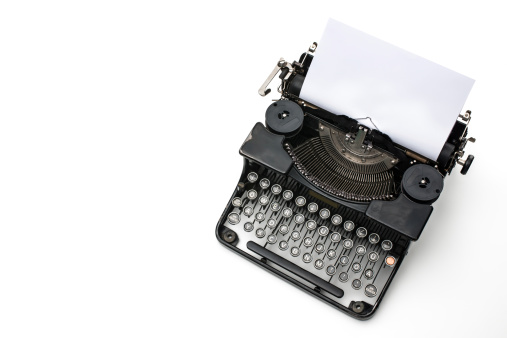 Vintage typewriter with paper sheet  on white background