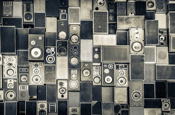 Speakers hanging on wall in monochrome style Music speakers hanging on the wall in monochrome vintage style musical equipment stock pictures, royalty-free photos & images