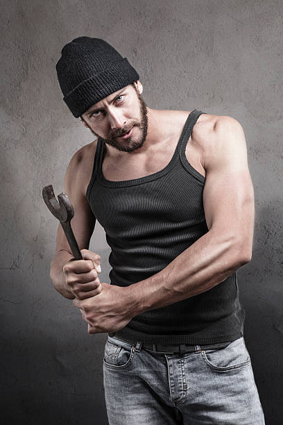 istock Thug preparing to use a wrench as a weapon 474096844
