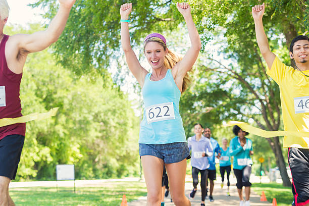 istock Woman celebrating winning marathon or 5k race 474097178