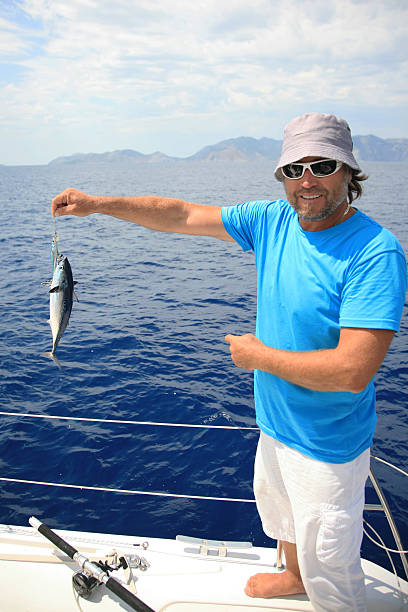 istock Fisherman with a baby bonito 474097282