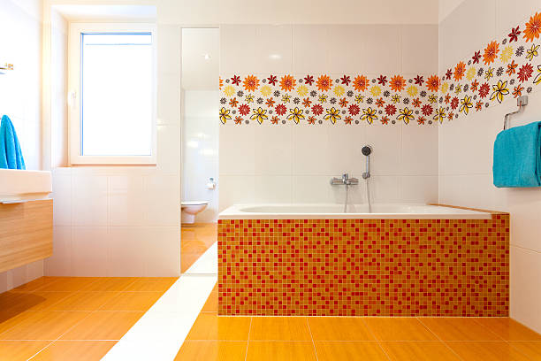 istock Big orange bath in cute contemporary bathroom 474097351