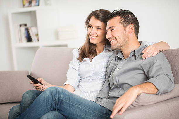 istock Young couple watching  tv 474097356