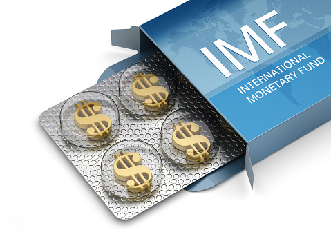 Gold dollar shapes inside IMF (international monetary fund) pillbox.