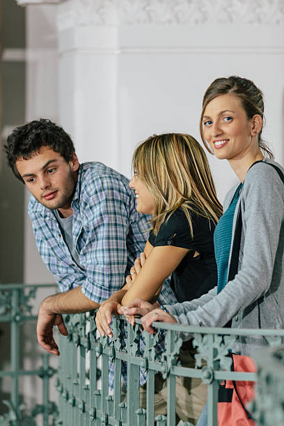 Three Happy and Young Students talking - 20s student stock photo