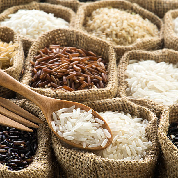 istock Closeup jasmine rice on wooden spoon 474100008