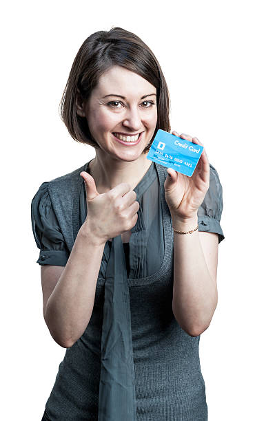 istock Young woman with credit card 474101413