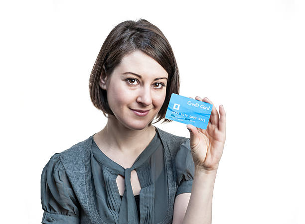 istock Young woman with credit card 474101429