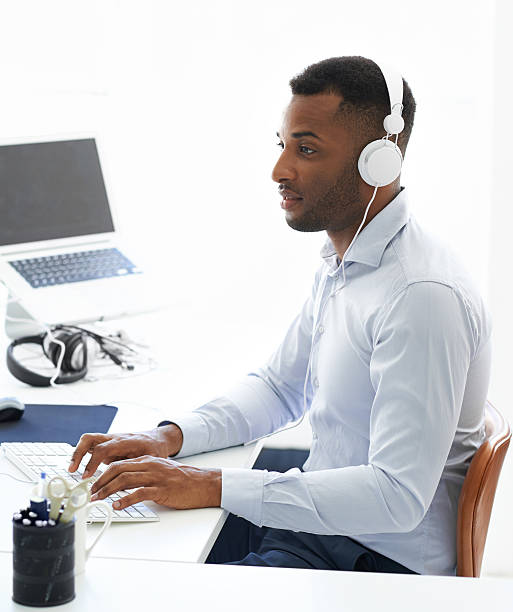 istock Listening to podcasts while he works 474101547