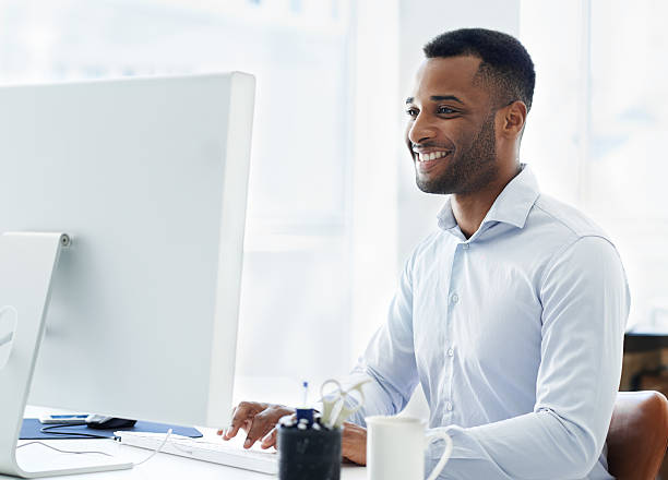 Man enjoying his work with computer screen stock photo