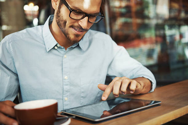 istock He's able check anything he wants with his touchscreen tablet 474103427