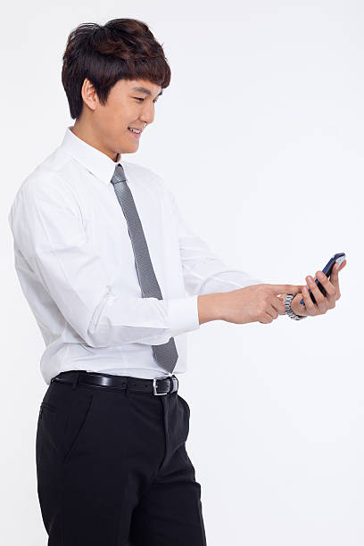 istock Asian business man with cellphone. 474108781