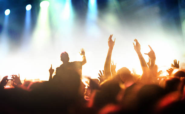 istock People at concert party. 474108840