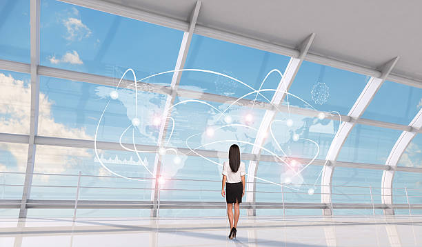istock Businesswoman standing back with world map 474109966