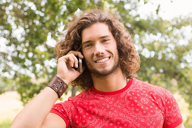 istock Happy young man on the phone 474111360