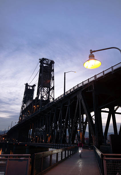 istock Pedestrian bicycle path bottom two stored lift bridge at night 474114262