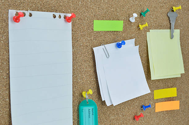 istock Sticky notes, pin, key and tag name on cork board 474117426