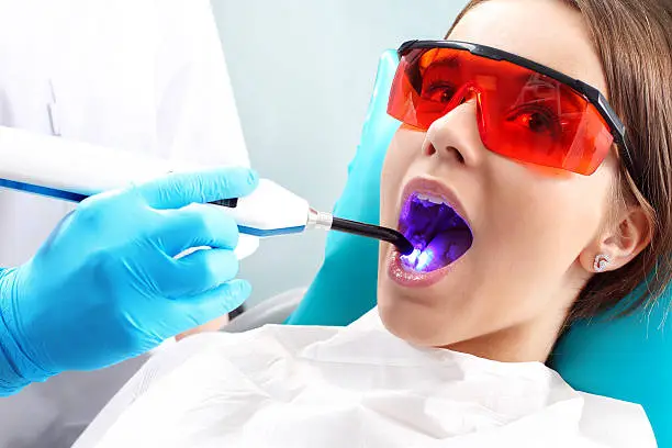 Woman at the dentist's chair during a dental procedure