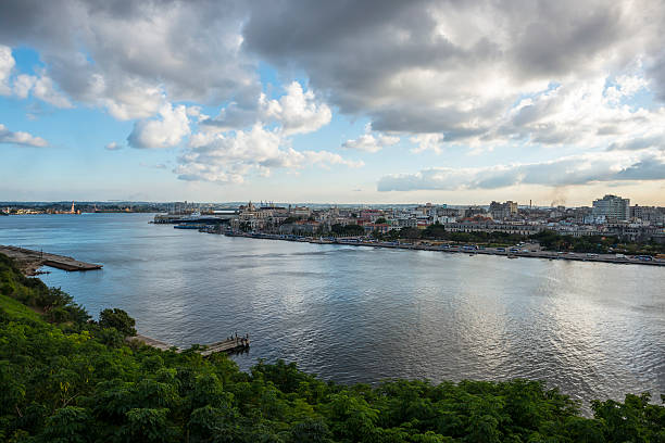 Habana Vieja seen from San Carlos de la Cabana Fort View of Havana's Old City, Habana Vieja, and Havana Harbor from atop the 18th-century San Carlos de la Cabana Fort in Havana, Cuba havana harbor photos stock pictures, royalty-free photos & images