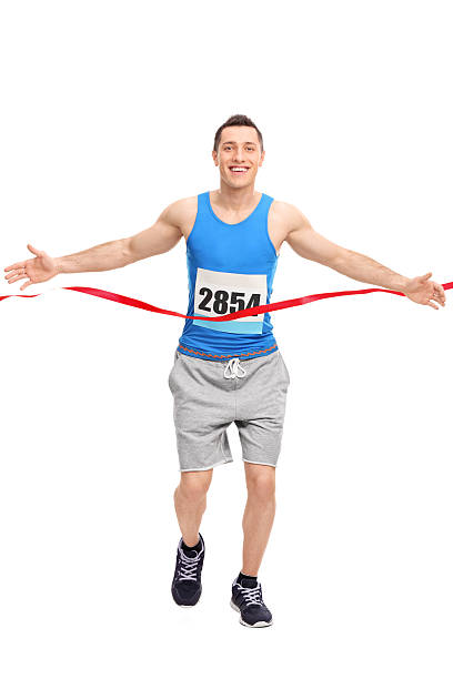 istock Male runner crossing the finish line 474121036