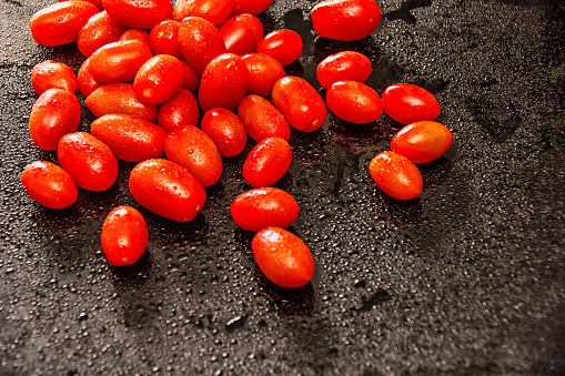 Delicate cherry tomatoes on the table. Post processing with Lightroom, Photoshop and Nick Software.