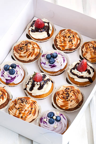 istock Set of different  cupcakes in a  box 474125886