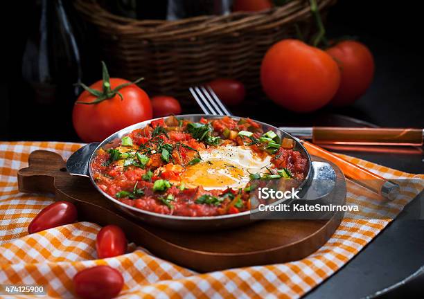 Shakshuka With Tomatoes And Eggs Stock Photo - Download Image Now - Kitchen, Libyan Culture, Shakshouka