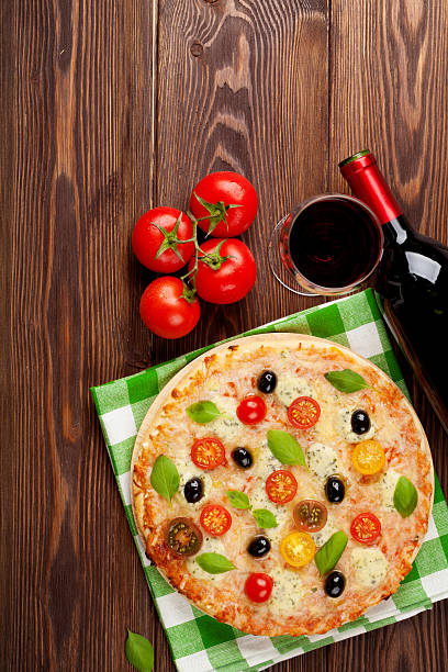 istock Italian pizza and red wine 474126942