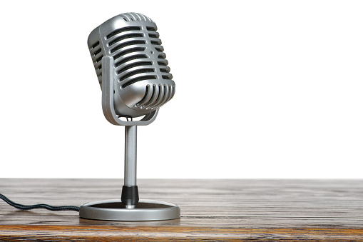 vintage microphone on a wooden surface