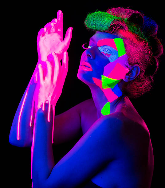 istock Women Portrait in Ultraviolet Light 474131629