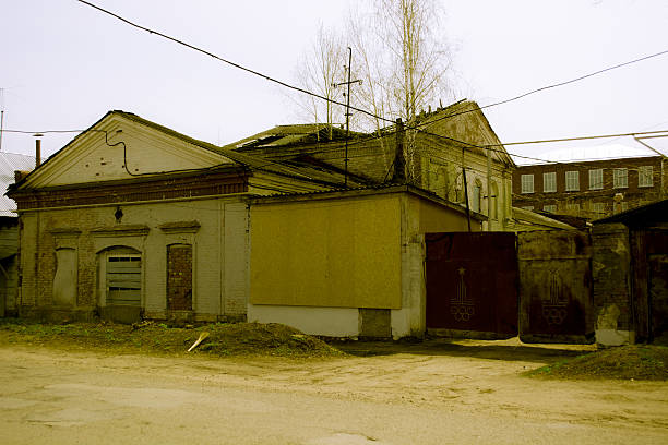 istock Destroyed building with boarded up windows of a bakery in 474131914