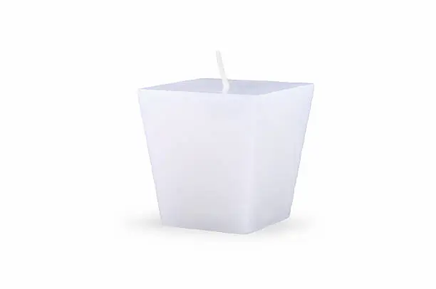 Bright rectangular candle on a white background