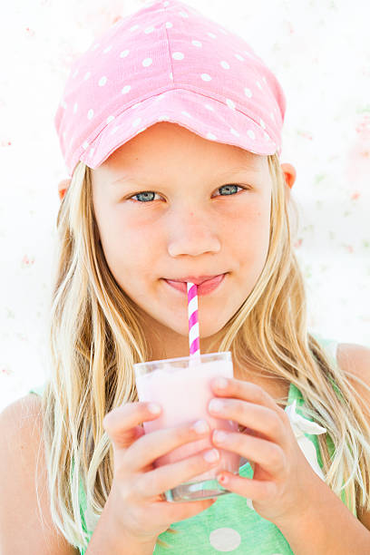istock Young girl drinking smoothie 474136683