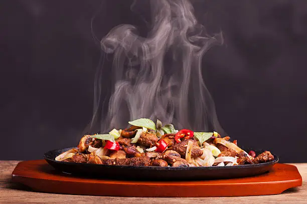 steaming chicken sizzler with noodles