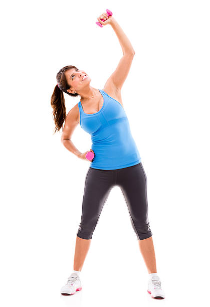 Happy woman exercising with weights - isolated over white