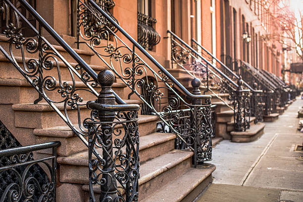 Brownstone Apartments Brownstone Apartment steps in the Chelsea neighborhood of New York City. doorstep stock pictures, royalty-free photos & images