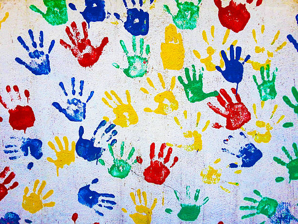 colored hand prints on white background stock photo