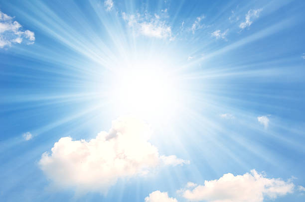 istock sky with little white clouds and sun 474143542