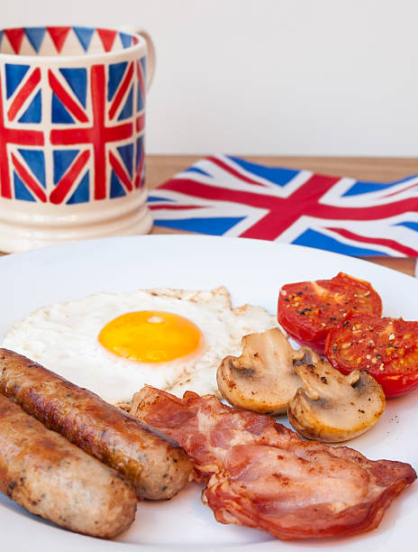 istock English breakfast with tea and british flag behind 474145521