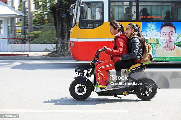 Riding Electric Motorbike On Street Stock Photo - Download Image Now - Electric Bicycle, Vietnam, Balance