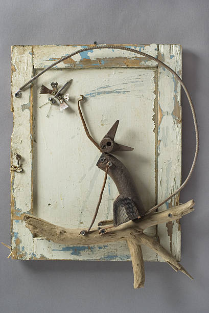 Recycled art: a sculpture of a steel cat catching a dragonfly.