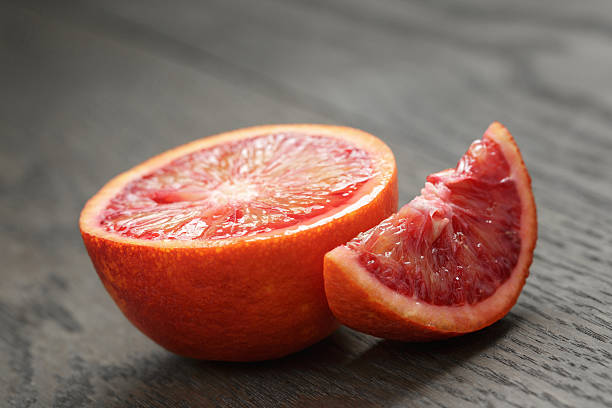 istock half and section of red orange on wooden table 474151316