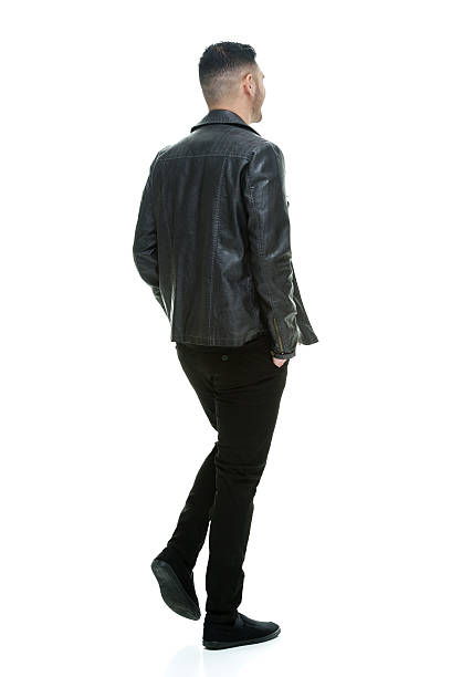 istock Rear view of casual man walking 474152504