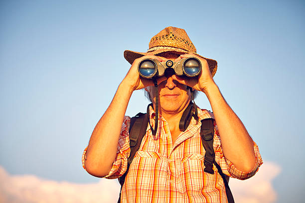 istock Portrait of man with hat and binoculars 474153038