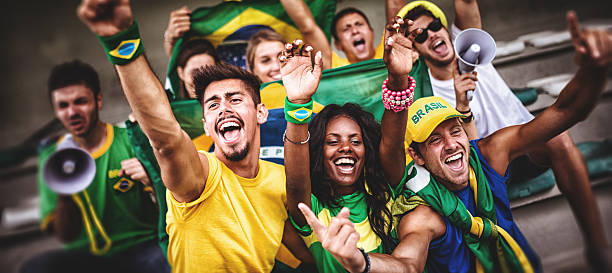 group of brazilian supporters at stadium - world cup stok fotoğraflar ve resimler