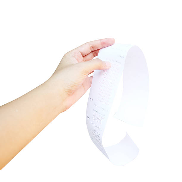 istock hand of woman checking a long receipt 474155588