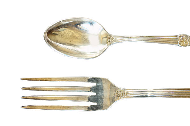 istock Nickel silver spoon and fork with ornament isolated 474161286