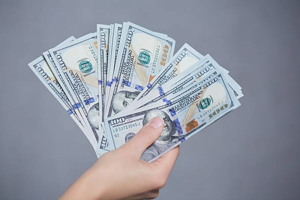 istock Money in female hands 474163520